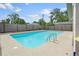 Backyard pool featuring concrete pavers, secure fencing, and sunny exposure at 1811 49Th N St, St Petersburg, FL 33710