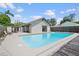 Backyard pool featuring concrete pavers and wooden deck at 1811 49Th N St, St Petersburg, FL 33710