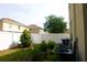 Fenced backyard with lawn and landscaping for added privacy and outdoor enjoyment at 18439 Red Willow Way, Land O Lakes, FL 34638
