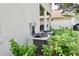 Secluded backyard featuring lush greenery around the air conditioning units on a sunny day at 18439 Red Willow Way, Land O Lakes, FL 34638