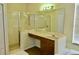 Clean primary bathroom features marble countertop and enclosed glass shower with tile detail at 18439 Red Willow Way, Land O Lakes, FL 34638