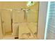 Bright bathroom featuring a glass shower, tile flooring, and marble countertop with mirror at 18439 Red Willow Way, Land O Lakes, FL 34638