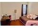 Bedroom with bed, curtains, and desk with a printer at 18439 Red Willow Way, Land O Lakes, FL 34638