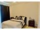 Cozy bedroom with neutral tones and furnishings create a relaxing ambiance at 18439 Red Willow Way, Land O Lakes, FL 34638