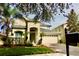 Charming two-story home featuring a well-manicured lawn, a two car garage and lush landscaping at 18439 Red Willow Way, Land O Lakes, FL 34638