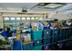 Cluttered garage filled with storage containers and household items at 18439 Red Willow Way, Land O Lakes, FL 34638