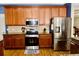 This open kitchen features stainless steel appliances and lots of counter space at 18439 Red Willow Way, Land O Lakes, FL 34638