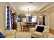 Comfortable living room featuring stylish furniture, elegant curtains, and an inviting dining area at 18439 Red Willow Way, Land O Lakes, FL 34638