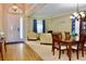 Spacious living room with hardwood floors, a comfortable seating area, and elegant dining furniture at 18439 Red Willow Way, Land O Lakes, FL 34638