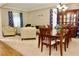 Spacious living room with a cozy seating arrangement and dining area for a comfortable living space at 18439 Red Willow Way, Land O Lakes, FL 34638