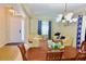 Welcoming living room featuring hardwood and carpet flooring, comfortable seating, and a dining area at 18439 Red Willow Way, Land O Lakes, FL 34638