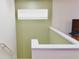 View of staircase shows railing detail and upper landing with painted walls at 18439 Red Willow Way, Land O Lakes, FL 34638