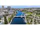An aerial view of the city skyline, river, bridge, and building complex, with ample surrounding greenery at 201 W Laurel St # 308, Tampa, FL 33602