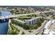 An aerial view of the building by the river with road, showcasing a beautiful complex surrounded by trees at 201 W Laurel St # 308, Tampa, FL 33602