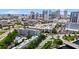 An aerial view of the building complex, showcasing the cityscape, nearby pool, and well-kept grounds at 201 W Laurel St # 308, Tampa, FL 33602