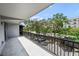 Enjoy views from this balcony, overlooking verdant greenery and convenient visitor parking spaces at 201 W Laurel St # 308, Tampa, FL 33602