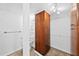 Bathroom featuring a separate toilet area with a tall cabinet, plus shelving and towel rack at 201 W Laurel St # 308, Tampa, FL 33602