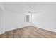 A comfortable bedroom with laminate flooring, a ceiling fan, and a window at 201 W Laurel St # 308, Tampa, FL 33602