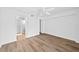 A bright bedroom features a ceiling fan, wood flooring, and an ensuite bathroom at 201 W Laurel St # 308, Tampa, FL 33602