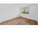 Bright bedroom featuring wood flooring and a window with blinds at 201 W Laurel St # 308, Tampa, FL 33602