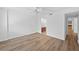 Bright bedroom with hardwood flooring, ceiling fan, and access to an ensuite bathroom at 201 W Laurel St # 308, Tampa, FL 33602
