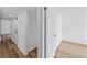A hallway features trim, laminate floors, closet and washer and dryer at 201 W Laurel St # 308, Tampa, FL 33602