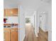 Kitchen featuring stainless steel sink, wood cabinets and open access to the living area at 201 W Laurel St # 308, Tampa, FL 33602