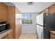 Cozy kitchen featuring stainless steel appliances, warm wood cabinets and lots of storage at 201 W Laurel St # 308, Tampa, FL 33602