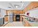 Traditional kitchen with tile flooring, stainless steel appliances and a stainless steel sink at 201 W Laurel St # 308, Tampa, FL 33602