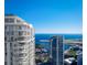 Stunning aerial view of luxurious condo building with multiple balconies overlooking the marina and city skyline at 235 1St S Ave # 3104, St Petersburg, FL 33701