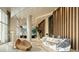 Elegant condo lobby with a sleek marble reception desk, unique seating, and modern wood-paneled walls at 235 1St S Ave # 3104, St Petersburg, FL 33701