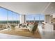 Bright, modern living room with floor-to-ceiling windows and stunning city views at 235 1St S Ave # 3206, St Petersburg, FL 33701