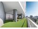 Outdoor dog run with artificial turf, benches, and play area; perfect for pet owners in this modern building at 235 1St S Ave # 3708, St Petersburg, FL 33701
