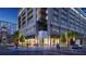 Upscale urban condominium with palm trees, sidewalk seating, and modern architecture at 235 1St S Ave # 3708, St Petersburg, FL 33701