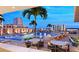 Stunning rooftop pool area with lounge chairs, palm trees, and panoramic city views for ultimate relaxation at 235 1St S Ave # 3708, St Petersburg, FL 33701