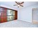 Bedroom with a ceiling fan and sliding door access to the balcony at 2413 Bayshore Blvd # 1903, Tampa, FL 33629