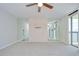Neutral-toned bedroom with a mirrored wall, carpet flooring, and a sliding glass door to the balcony at 2413 Bayshore Blvd # 1903, Tampa, FL 33629
