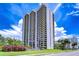 Striking exterior view of the high-rise condo building, surrounded by manicured landscaping at 2413 Bayshore Blvd # 1903, Tampa, FL 33629