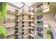 Multi-story atrium showcasing modern architecture, multiple balconies, natural light, and manicured greenery at 2413 Bayshore Blvd # 1903, Tampa, FL 33629
