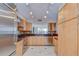 Well-equipped kitchen with stainless steel appliances, wood cabinets, and tile backsplash at 2413 Bayshore Blvd # 1903, Tampa, FL 33629