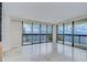 Sunlit living room featuring expansive windows and sliding glass doors leading to a balcony at 2413 Bayshore Blvd # 1903, Tampa, FL 33629