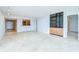 Open floor plan living area featuring light grey walls, marble flooring, and a breakfast bar at 2413 Bayshore Blvd # 1903, Tampa, FL 33629