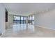 Bright living room with tiled floors and large windows offering scenic water views and balcony access at 2413 Bayshore Blvd # 1903, Tampa, FL 33629