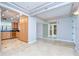 Open living space with kitchen view featuring tile floors and neutral walls and kitchen cabinetry at 2413 Bayshore Blvd # 1903, Tampa, FL 33629