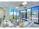 Cozy lounge area with comfortable seating, scenic ocean views, and access to an outdoor pool area at 2413 Bayshore Blvd # 1903, Tampa, FL 33629