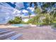 Outdoor pool and patio area with plenty of lounge chairs and water views at 2413 Bayshore Blvd # 1903, Tampa, FL 33629