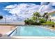 Outdoor pool with plenty of lounge chairs, privacy landscaping, and water views at 2413 Bayshore Blvd # 1903, Tampa, FL 33629