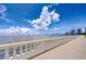 Breathtaking waterfront view with clear blue skies and fluffy clouds from the building's walking path at 2413 Bayshore Blvd # 1903, Tampa, FL 33629