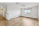 Bright bedroom with wood flooring, large window, and neutral wall color at 25737 Frith St, Land O Lakes, FL 34639