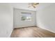 Bedroom featuring wood-look flooring, a ceiling fan, and a window for natural light at 25737 Frith St, Land O Lakes, FL 34639